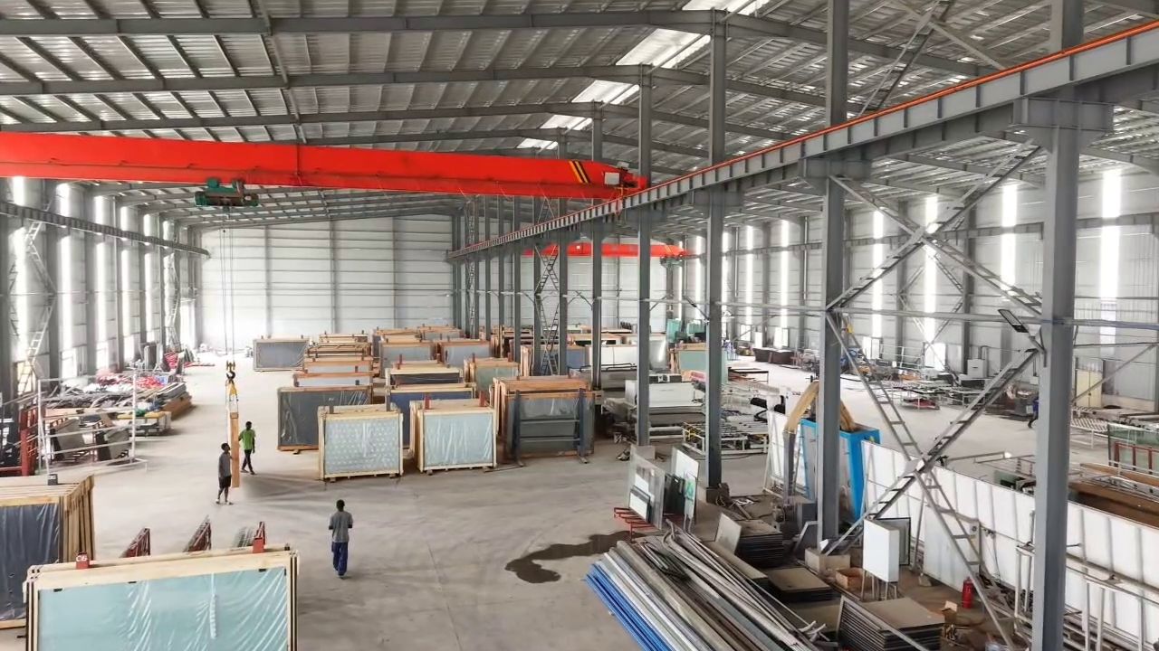 Wide view of the workshop floor with an overhead crane